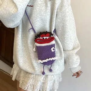 Handmade purple crochet sausage mouth bucket bag with fun cartoon eyes and woven strap