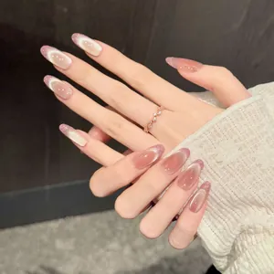Close-up of nude pink cat-eye press-on nails with glitter gradient and oval shape