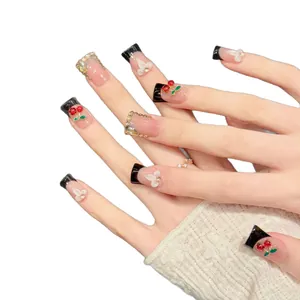 Handmade black French press-on nails with 3D red cherries and crystal flower accents