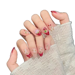 Handmade forest mushroom press-on nails with red polka dots and floral 3D accents