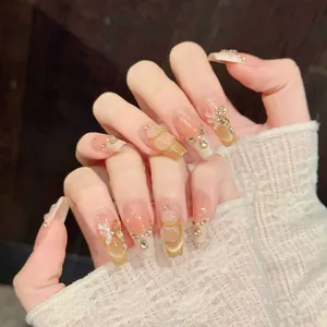 Detailed view of handmade press-on nails with 3D bears, bows, and cat eye gradient finish