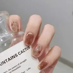 Handmade amber press-on nails with ice camellia hand-painted marbling and gold edges