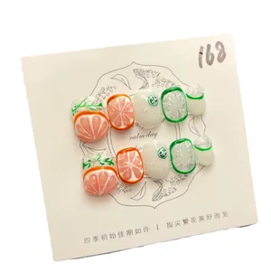 Uñas postizas artesanales de cítricos con relieve 3D y diseños de naranjas y hojas
