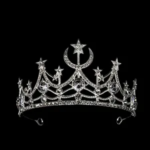 Elegant silver star and moon tiara with sparkling crystals on black background