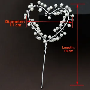 Detail of heart cake topper with pearls and crystals measuring 11cm diameter and 18cm long