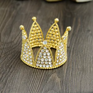 Detailed macro view of a gold mini crown with sparkling rhinestones on wood