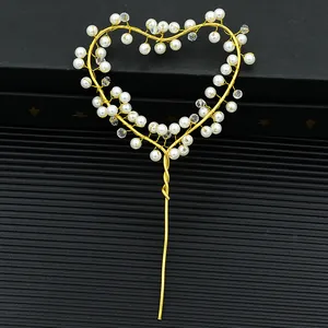 Golden heart cake topper with elegant pearls and crystals for birthday party decoration
