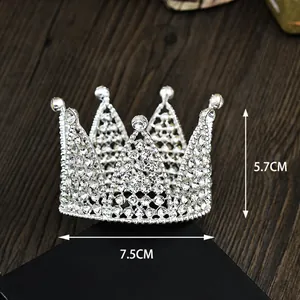 Silver mini crown cake topper with sparkling rhinestones, 7.5cm wide and 5.7cm high