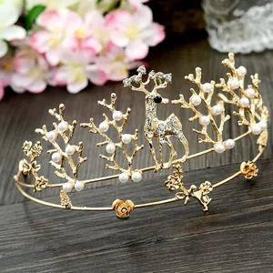 Elegant gold reindeer crown with pearls and rhinestones for bridal cake toppers