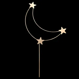 Minimalist gold moon and star metal cake topper with sparkling rhinestone accents