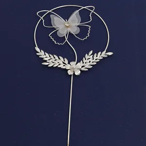 Silver wrought iron cake topper with tulle butterfly, sparkling rhinestones and pearls