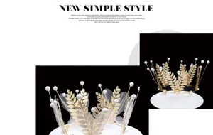 Detailed view of golden leaf crown with pearls for bridal accessories or cake decor