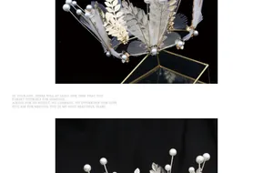Detail of bridal gold leaf crown with delicate pearls and white mesh on black satin