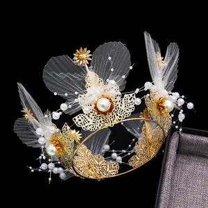 Golden flower crown cake topper with white pearls and mesh lace for festive desserts
