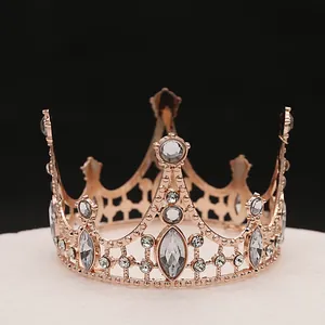 Macro shot of rose gold crown with marquise diamonds for cake decoration or headwear