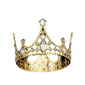 Elegant gold crown cake topper with sparkling crystals and rhinestones for decoration