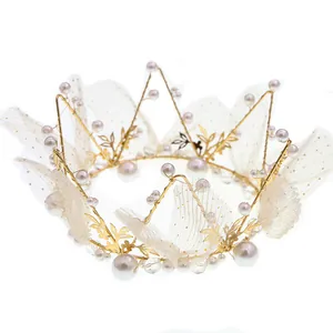 Elegant gold crown with white pearls and polka dot mesh for wedding or party cake decor