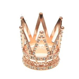 Elegant rose gold mini crown cake topper with sparkling crystals for birthday parties