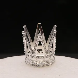 Mini silver crown cake topper with sparkling rhinestones for princess birthday party