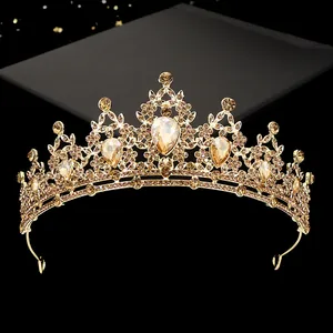 Baroque gold bridal crown with champagne rhinestones and water drop gems on black base
