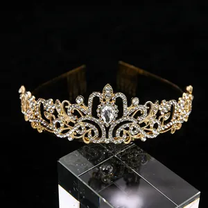 Macro detail of golden bridal tiara with sparkling rhinestones and vintage carving