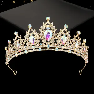 Macro detail of golden tiara featuring iridescent teardrop crystals and intricate patterns