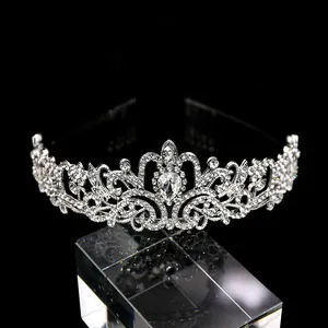 Detailed view of silver bridal tiara featuring teardrop rhinestones and luxury marquise crystals