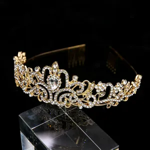 Detailed macro of gold bridal hair comb with baroque rhinestones and drop crystal