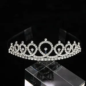 Detailed view of silver birthday crown with sparkling crystals and integrated hair combs