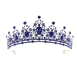 Elegant silver bridal crown with deep blue rhinestones for princess hair styling