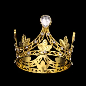 Golden crown with leaf patterns and drop-shaped crystal for birthday or wedding parties