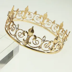 Detailed macro of golden crown featuring rhinestone fleur-de-lis and crystal accents