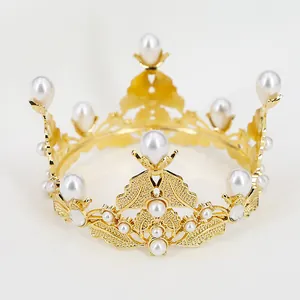 Detailed close-up of golden hollowed crown with white pearls for birthdays and weddings