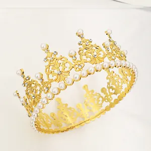 Elegant gold cake topper crown with white pearls and sparkling rhinestones for party decor