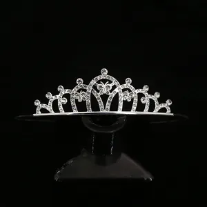 Elegant silver tiara with crystal rhinestones and central butterfly design for weddings