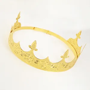 Macro detail of the golden metal crown showing intricate fleur-de-lis patterns and engraving