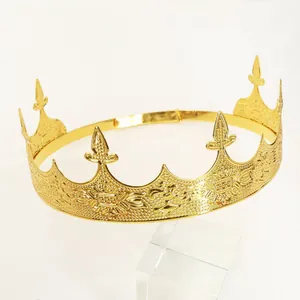 Macro view of gold royal crown featuring baroque floral carvings and adjustable ring buckle