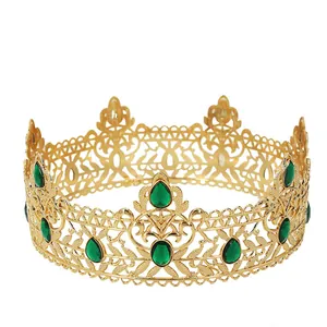 Baroque gold royal crown with intricate metal hollow patterns and green teardrop emeralds