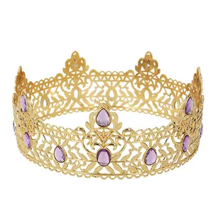 Detailed close-up of golden baroque crown featuring intricate hollow carvings and purple gems