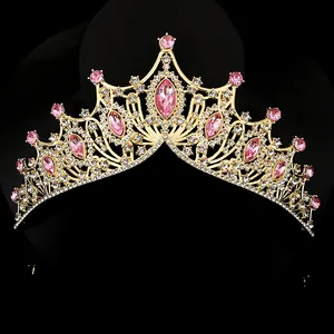 Detail of vintage gold bridal crown with pink crystals and shimmering white rhinestones