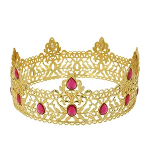 Detailed view of Baroque gold crown featuring intricate filigree and red teardrop gems
