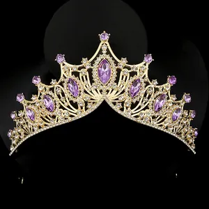 Macro detail of royal crystal tiara with purple gemstones and golden frame