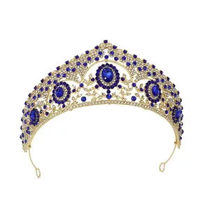 Golden baroque crown with navy blue crystals and vintage hollow filigree design