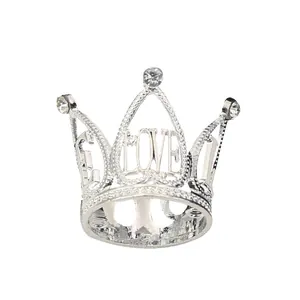 Silver mini crown cake topper with LOVE lettering and sparkling rhinestone accents