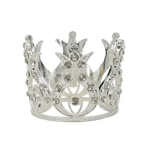 Elegant silver crown cake topper with sparkling rhinestones and openwork metal design