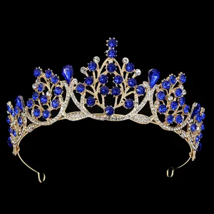 Detail of baroque crown with royal blue teardrop gemstones and gold alloy filigree