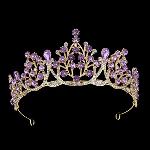 Golden baroque bridal crown with sparkling purple crystals and intricate flower designs