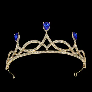Elegant gold bridal crown with blue teardrop crystals and sparkling rhinestones