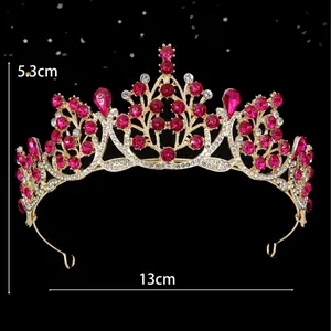 Golden baroque bridal crown with magenta crystals and dimensions 5.3cm height and 13cm width