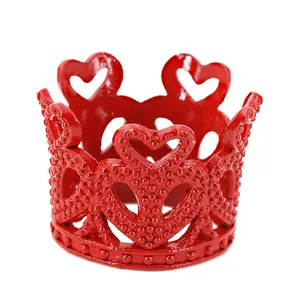 Red mini crown cake topper decoration featuring hollow heart patterns and textured metal finish